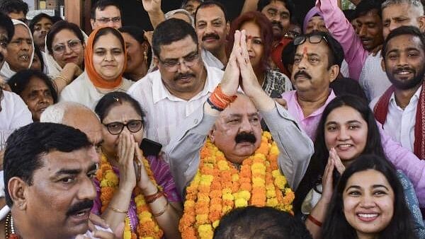 <div class="paragraphs"><p>Congress candidate from Amethi constituency Kishori Lal Sharma celebrates with others as he leads in the Lok Sabha elections on the day of the counting of votes, in Amethi, Tuesday, June 4, 2024.</p></div>