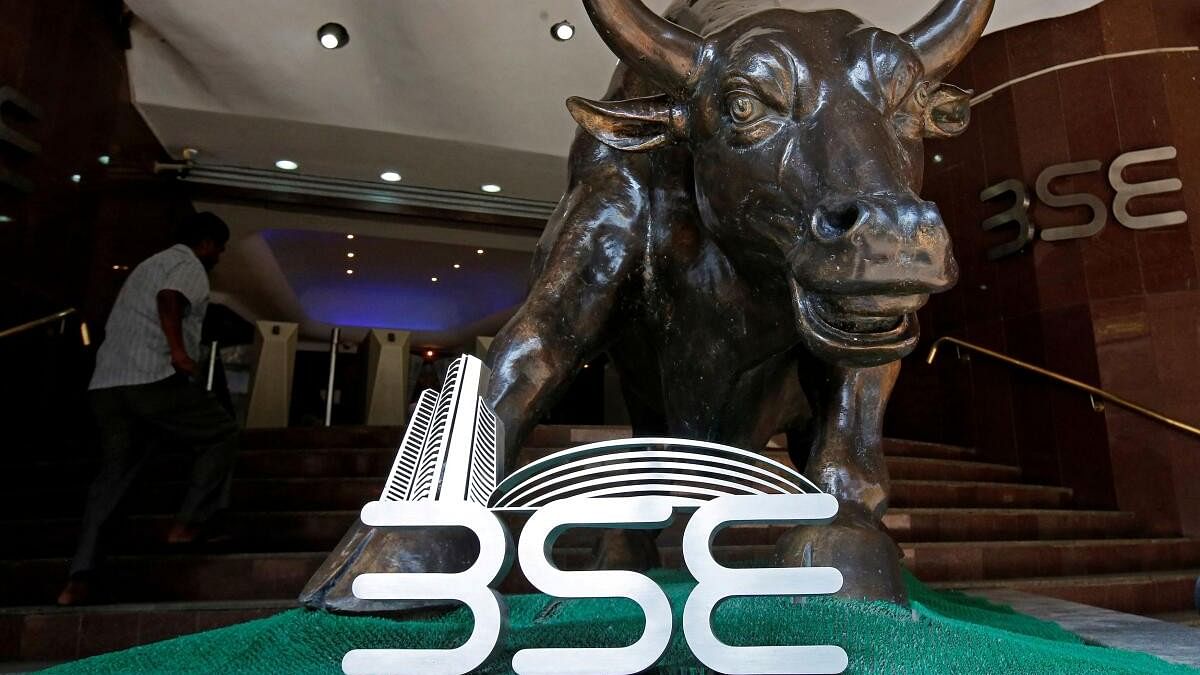 <div class="paragraphs"><p>The Bombay Stock Exchange (BSE) logo is seen under a bull statue at the entrance of their building in Mumbai</p></div>