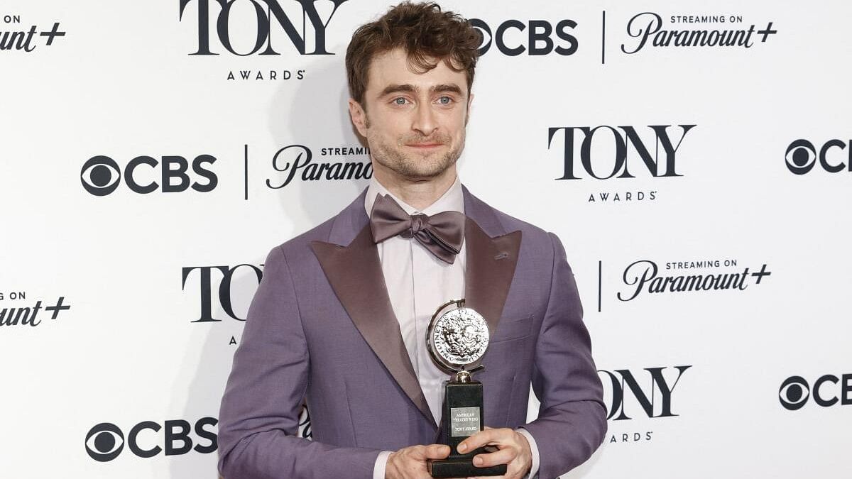 <div class="paragraphs"><p>Daniel Radcliffe poses with the award for Best Performance by a Featured Actor in a Musical for <em>Merrily We Roll Along</em> at the 77th Annual Tony Awards in New York City. </p></div>