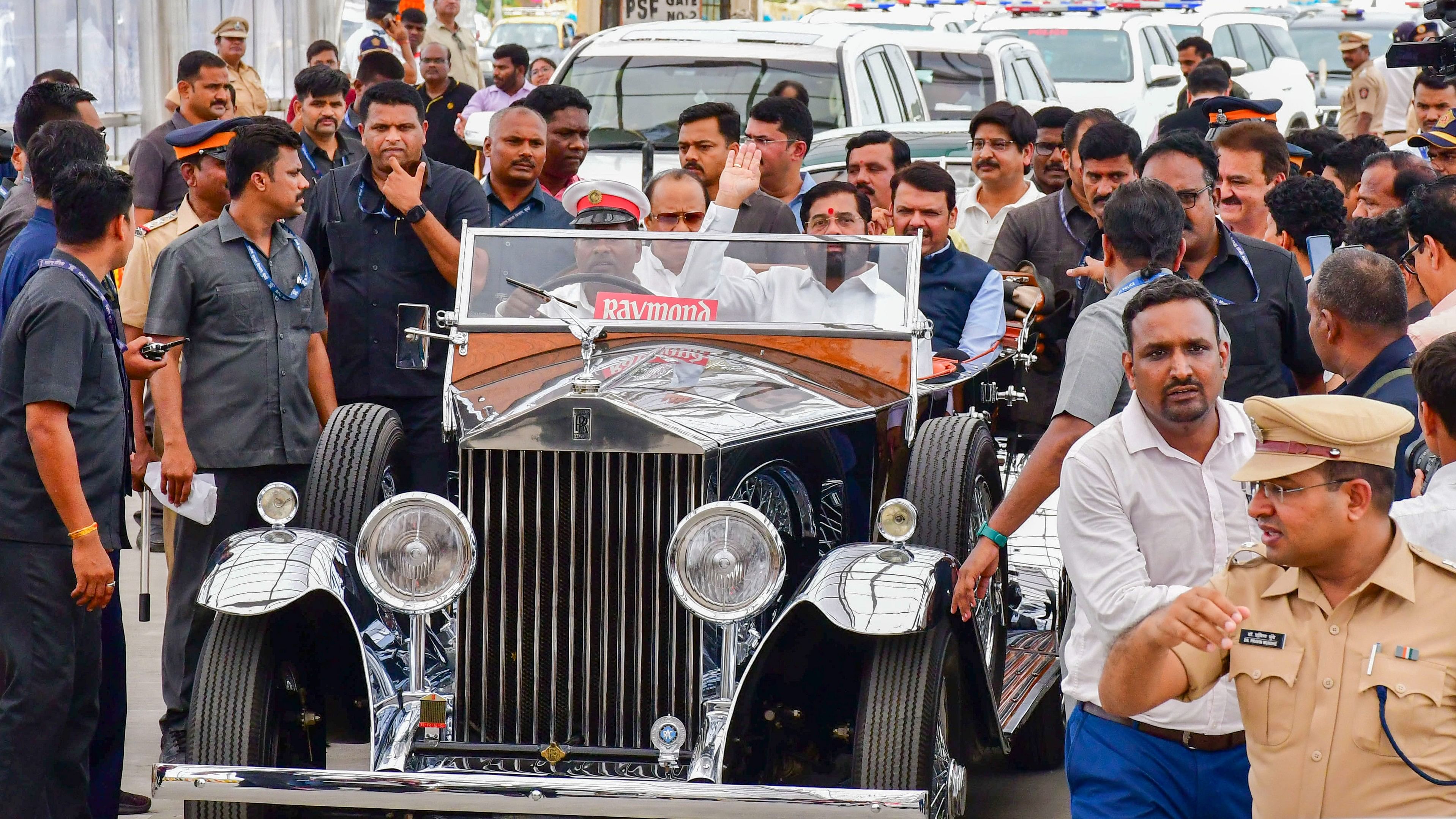 <div class="paragraphs"><p>hief Minister Eknath Shinde along with Deputy Chief Ministers Devendra Fadnavis and Ajit Pawar rides a vintage Rolls Royce car during the inauguration of the northbound arm of the Mumbai Coastal Road, in Mumbai, Monday, June 10, 2024.</p></div>