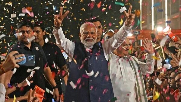 <div class="paragraphs"><p>Prime Minister Narendra Modi greets party workers upon his arrival for a meeting at the party headquarters as the party leads in the Lok Sabha elections amid the counting of votes, in New Delhi, Tuesday, June 4, 2024.</p></div>