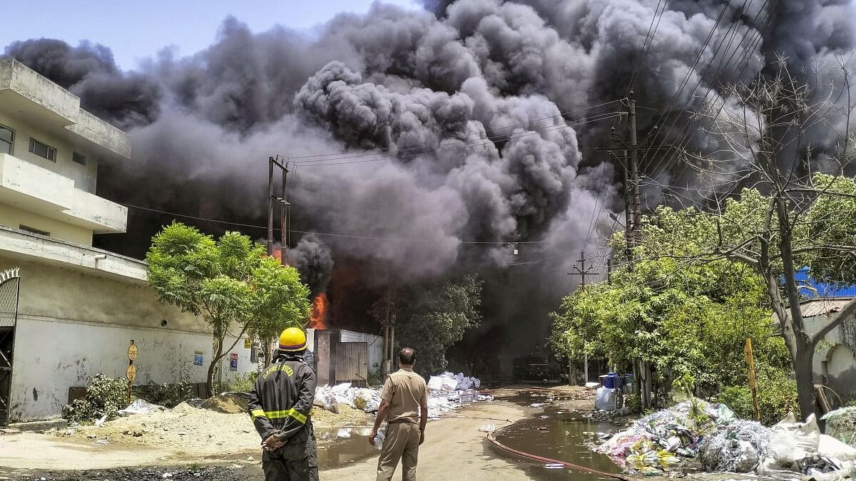 <div class="paragraphs"><p>Smoke billows after a fire broke out in a factory, at Loni in Ghaziabad district.</p></div>