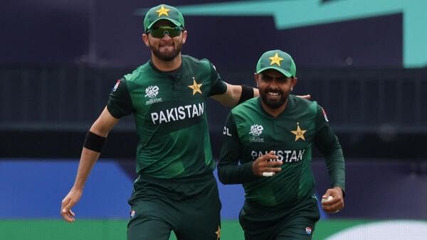 <div class="paragraphs"><p> Pakistan's Babar Azam celebrates with Shaheen Shah Afridi after taking the wicket of India's Rishabh Pant during the India V Pakistan match at Nassau County International Cricket Stadium, New York, United States on June 9</p></div>