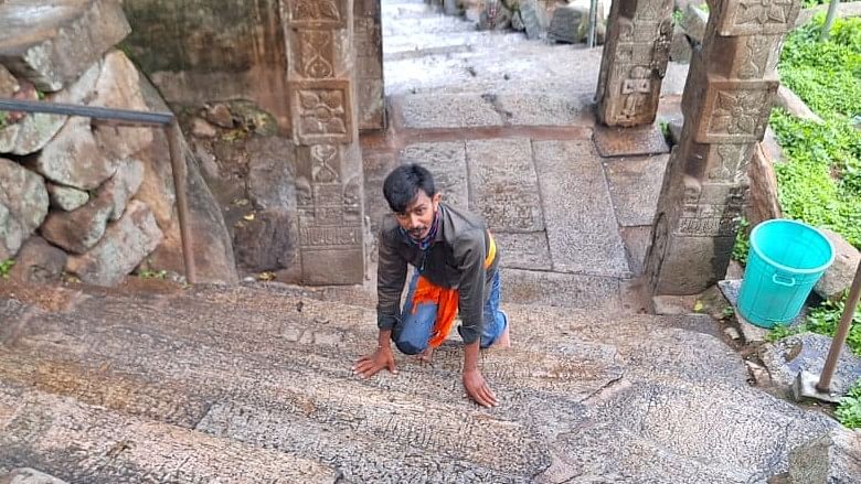 <div class="paragraphs"><p>Lokesh from Chikka Mandya climbs Sri Yoga Narasimha Swamy hill with his knees.</p></div>