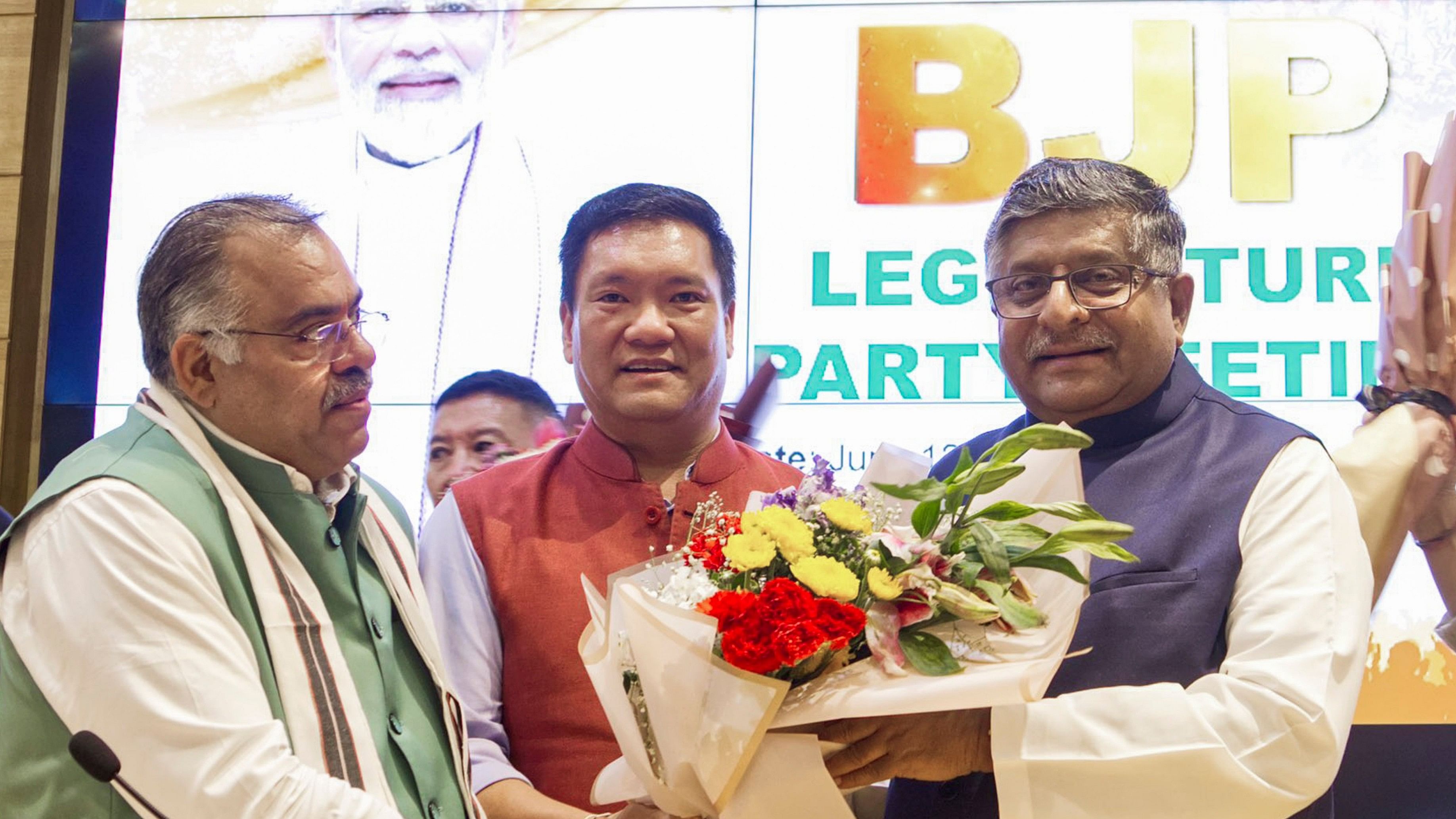 <div class="paragraphs"><p>BJP MP Ravi Shankar Prasad felicitates party MLA Pema Khandu after the latter was elected as the leader of the Legislature Party of Arunachal Pradesh and CM-designate of the state</p></div>