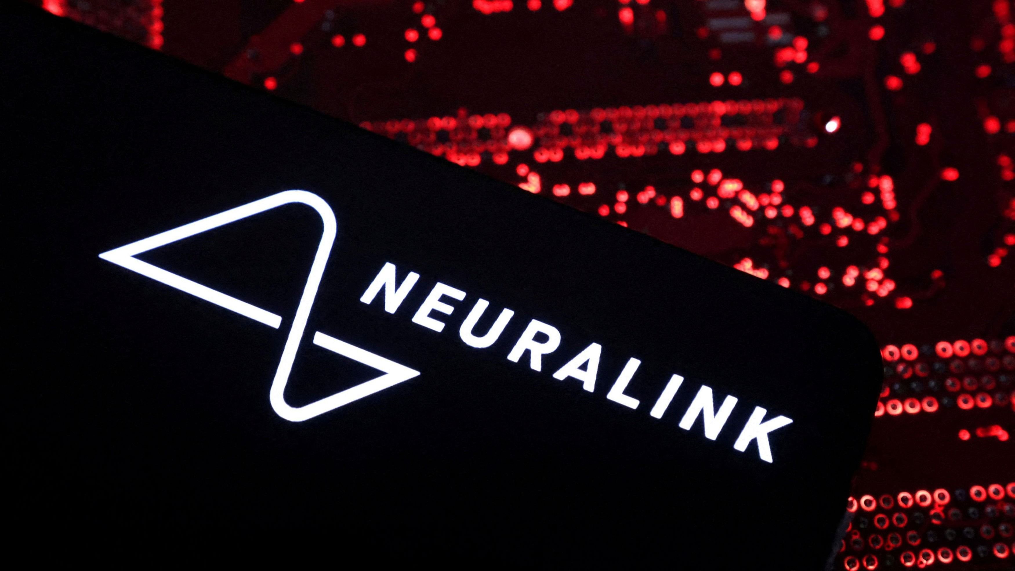 <div class="paragraphs"><p>A smartphone with a Neuralink logo displayed.</p></div>