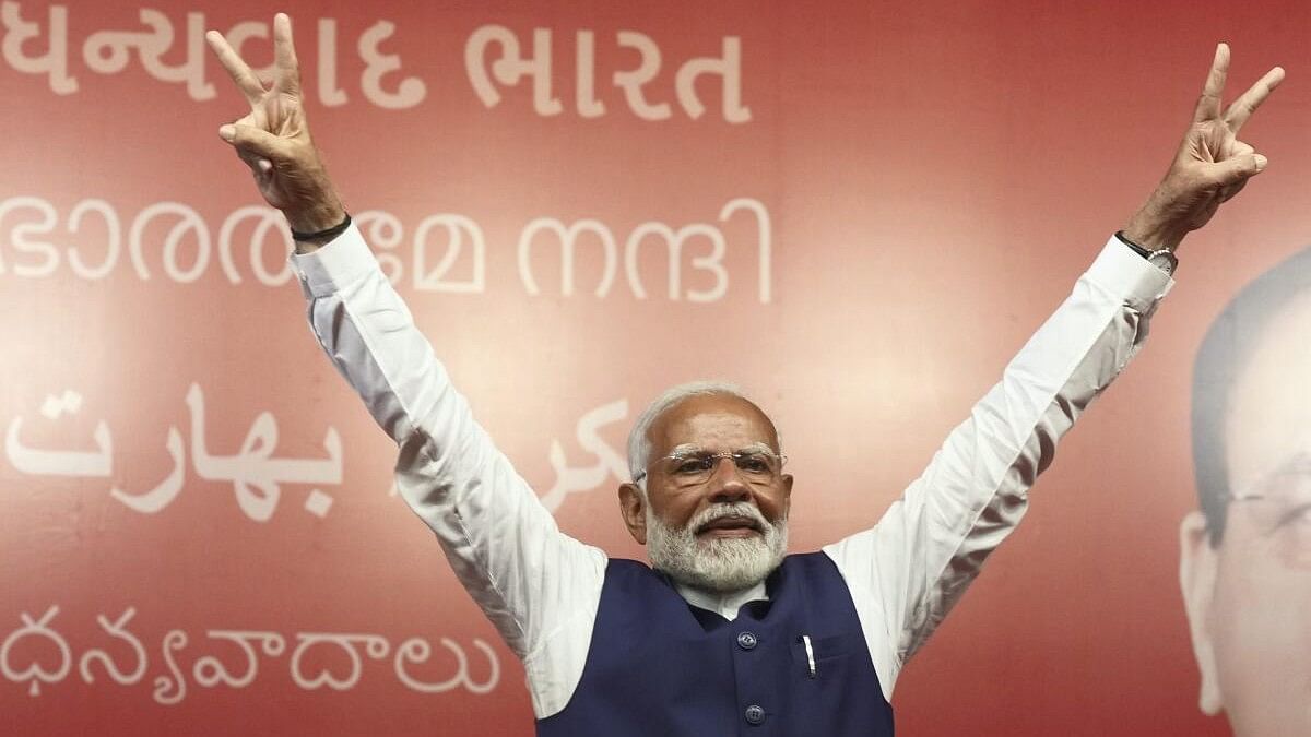 <div class="paragraphs"><p>Prime Minister Narendra Modi greets party workers upon his arrival for a meeting at the party headquarters as the party leads in the Lok Sabha elections amid the counting of votes, in New Delhi</p></div>