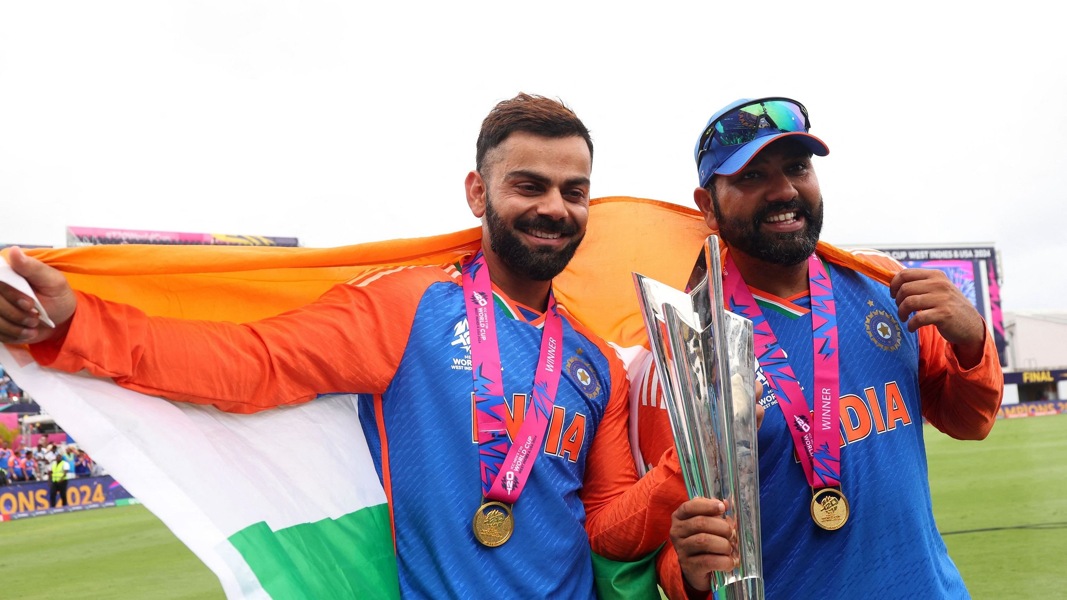 <div class="paragraphs"><p>Virat Kohli and Rohit Sharma celebrate with the trophy after winning.</p></div>