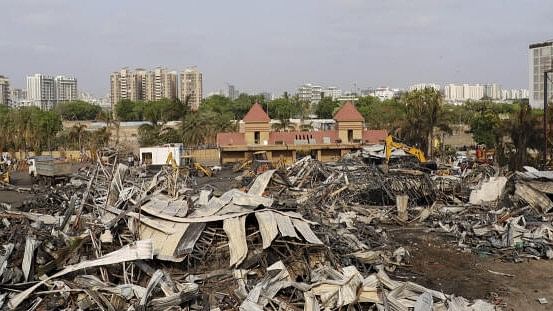 <div class="paragraphs"><p>Debris being removed from the game zone site where a major fire on Saturday evening killed at least 27 people and injured three, in Rajkot</p></div>