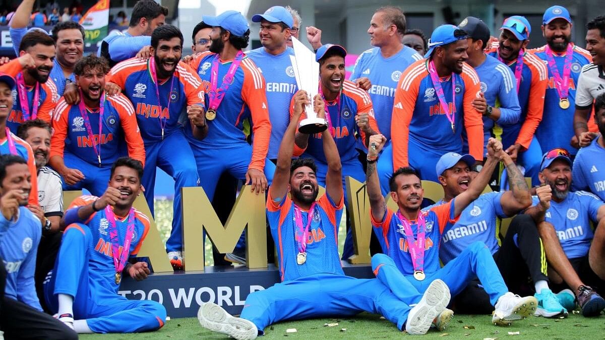 <div class="paragraphs"><p>India players celebrate with the trophy after winning the T20 World Cup.</p></div>
