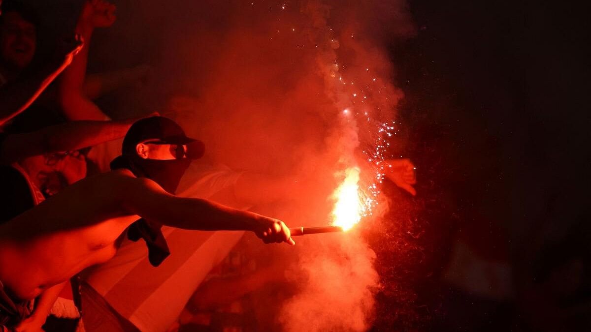 <div class="paragraphs"><p>Croatia fan with a flare in the stands.</p></div>