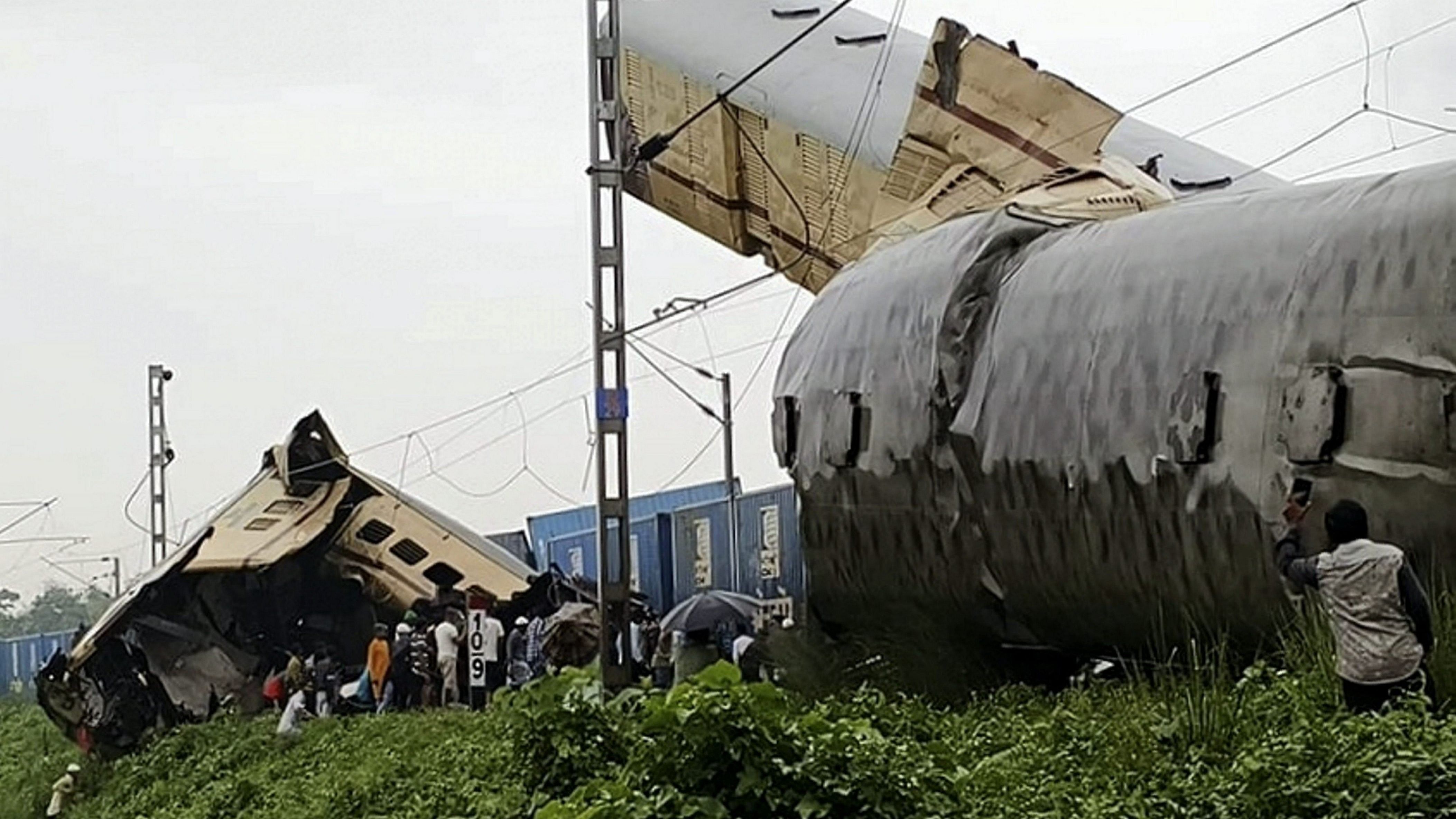 <div class="paragraphs"><p>Locals gather at the accident site after a collision between the Kanchanjungha Express and a goods train, near Rangapani railway station in West Bengal.</p></div>