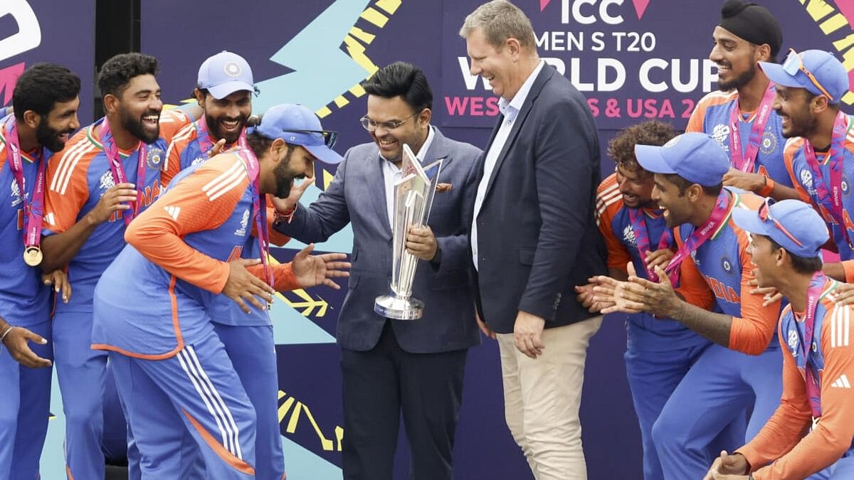<div class="paragraphs"><p>India's captain Rohit Sharma walks to receive the winners trophy after defeating South Africa in the ICC Men's T20 World Cup final cricket match, at Kensington Oval, in Bridgetown, Barbados, Sunday, June 30, 2024.</p></div>