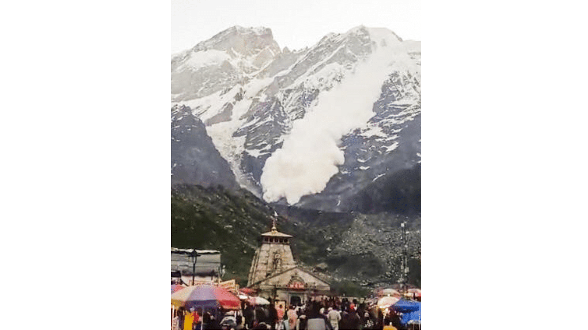 <div class="paragraphs"><p>Snow comes down a cliff during an avalanche after a glacier broke down as devotees offer prayers at Kedarnath dham, in Rudraprayag district.&nbsp;</p></div>