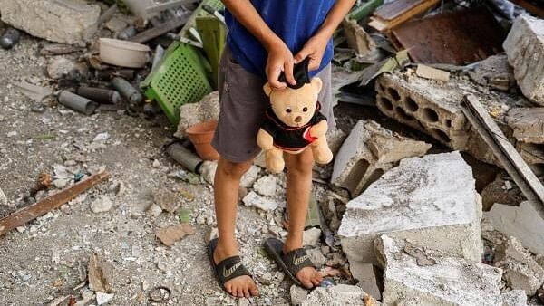 <div class="paragraphs"><p>Child holds a teddy bear, in Al-Faraa refugee camp near Tubas.</p></div>