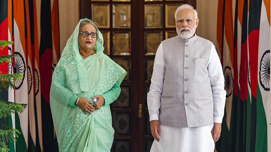 <div class="paragraphs"><p>Prime Minister Narendra Modi (R) and Prime Minister of Bangladesh Sheikh Hasina (L).</p></div>