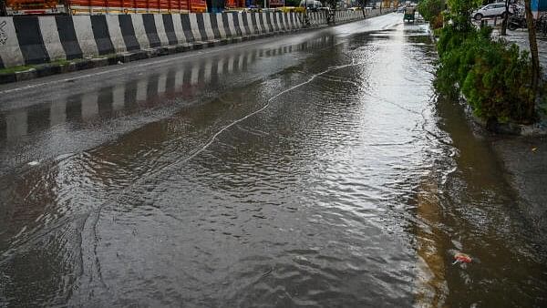 <div class="paragraphs"><p>Motorist run vehicles in Rain water flowing on the road at HAL Main road (Old Airport road) Murugesh Palya in Bengaluru.<strong><br></strong></p></div>