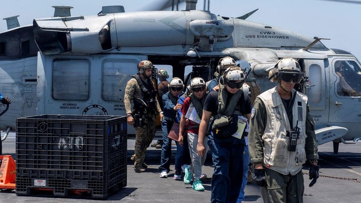 <div class="paragraphs"><p>Sailors from the Dwight D Eisenhower Carrier Strike Group assist distressed mariners rescued from the Greek-owned bulk carrier M/V Tutor that was attacked by Houthis in the Red Sea</p></div>