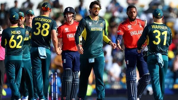 <div class="paragraphs"><p>England's Chris Jordan shakes hands with Australia's David Warner after the match.</p></div>