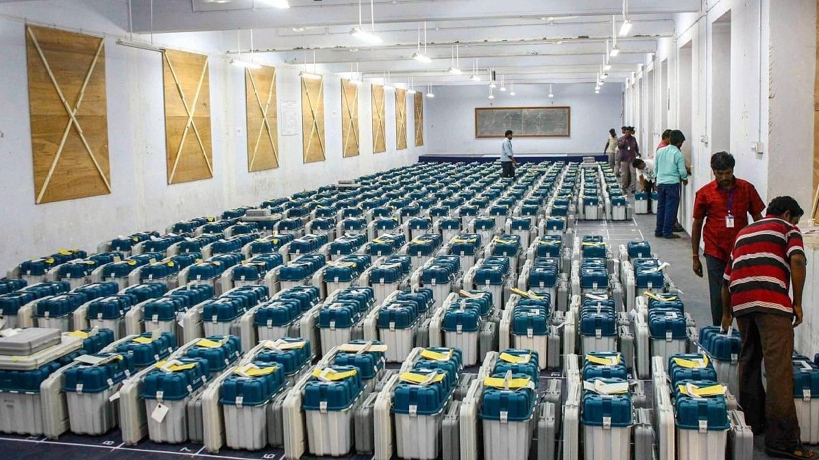 <div class="paragraphs"><p>Electronic Voting Machines (EVMs) being lined up and stored.</p></div>