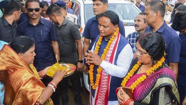 <div class="paragraphs"><p>Odisha Chief Minister Mohan Charan Majhi being welcomed by his family members during a visit to his native place, in Keonjhar district of Odisha, Monday, June 24, 2024.</p></div>