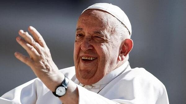 <div class="paragraphs"><p>Pope Francis reacts on the day he holds a weekly general audience at Saint Peter's Square at the Vatican.&nbsp;</p></div>