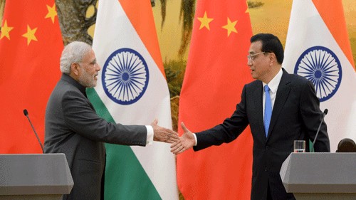 <div class="paragraphs"><p>File photo of Indian Prime Minister Modi shakes hands with Chinese Premier Li during a news conference at the Great Hall of the People in Beijing. </p></div>