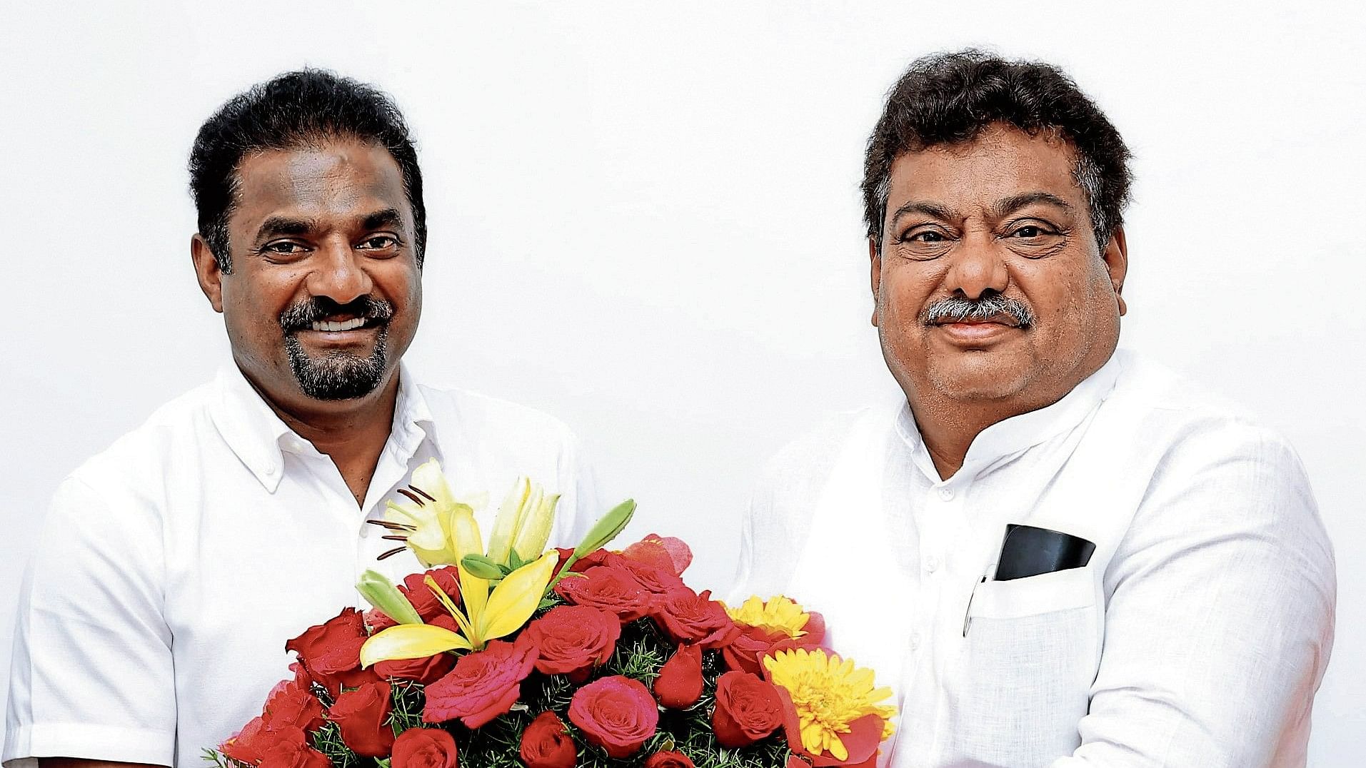 Cricketing legend Muthaiah Muralidharan with Industries Minister M B Patil.