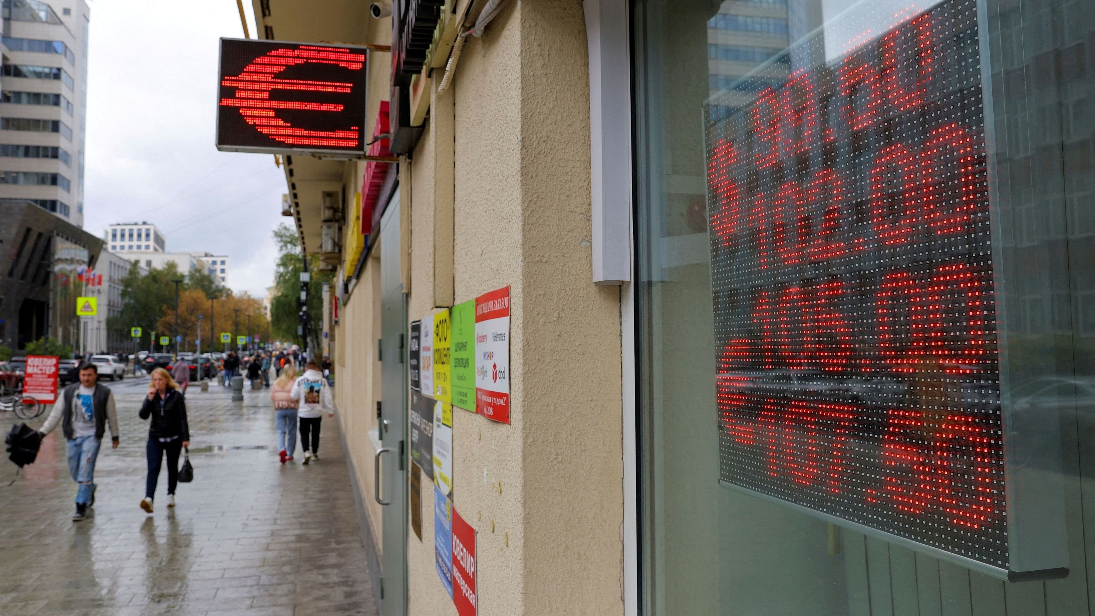 <div class="paragraphs"><p>FILE PHOTO: A board showing currency exchange rates of the US dollar and euro against Russian rouble is on display in a street in Moscow, Russia.</p></div>