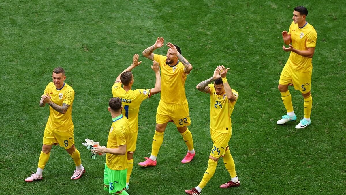 <div class="paragraphs"><p>Romanian players celebrate their win over Ukraine.&nbsp;</p></div>