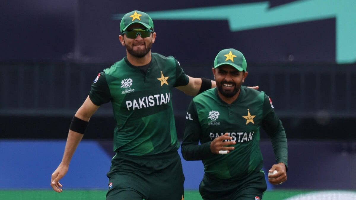 <div class="paragraphs"><p>Pakistan's Babar Azam celebrates with Shaheen Shah Afridi after taking the wicket of India's Rishabh Pant.</p></div>