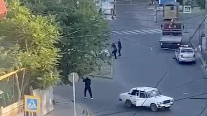 <div class="paragraphs"><p>A view shows a shooting scene on the street of Makhachkala, Dagestan, in southern Russia, June 23, 2024, in this still image obtained from a video. </p></div>