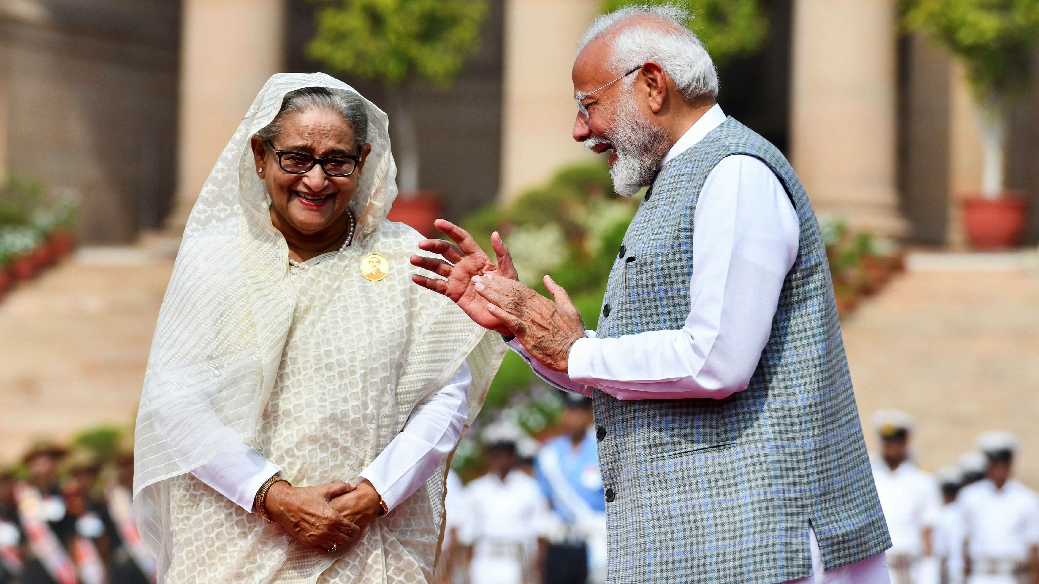 <div class="paragraphs"><p>India's Prime Minister Narendra Modi speaks with Bangladesh's Prime Minister Sheikh Hasina during her ceremonial reception at India's Rashtrapati Bhavan Presidential Palace, in New Delhi, India, June 22, 2024. </p></div>