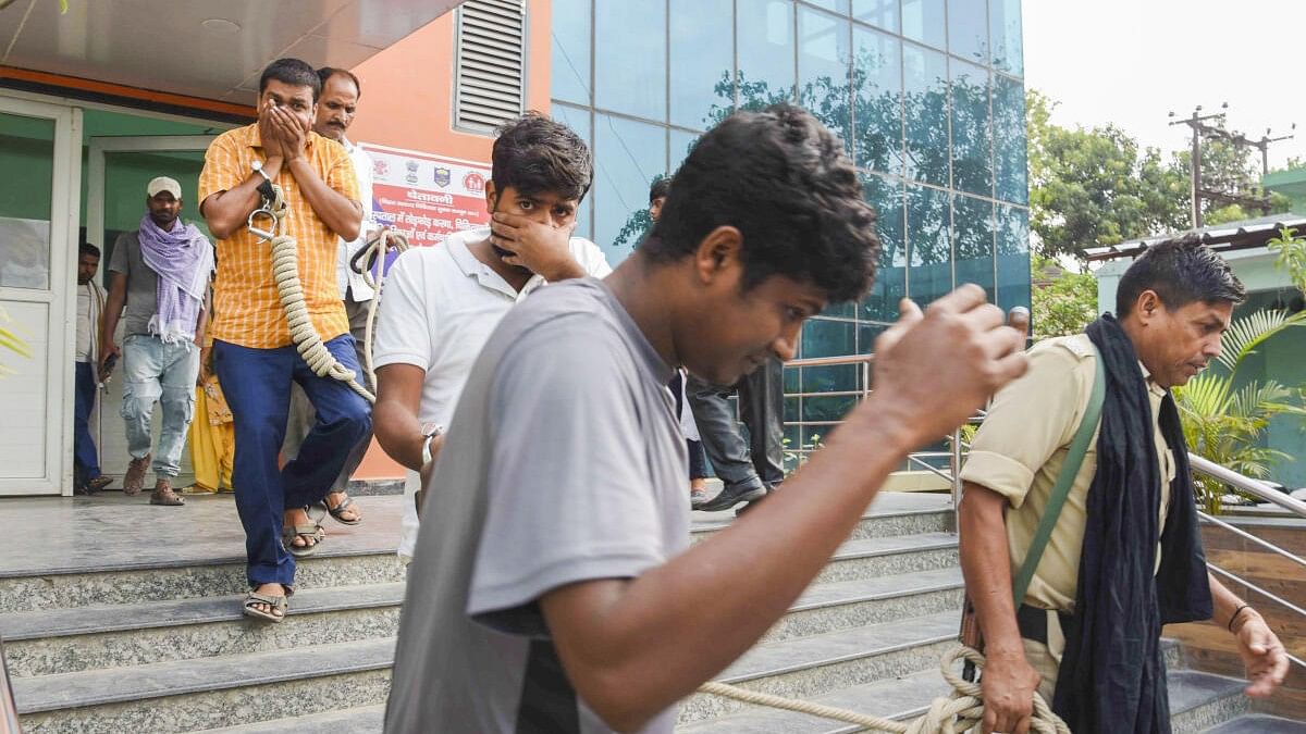 <div class="paragraphs"><p>Economic Offences Unit (EOU) personnel leave with the accused arrested for the alleged irregularities in NEET-UG exams 2024 case in Patna.&nbsp;</p></div>