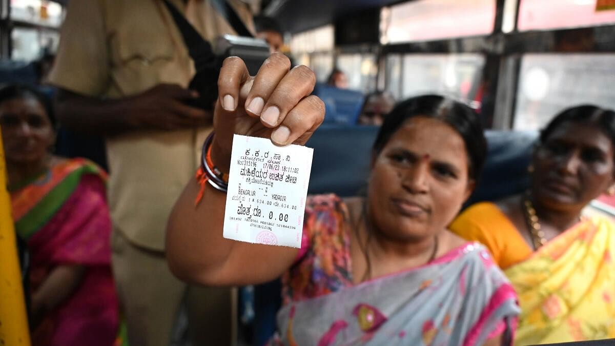 <div class="paragraphs"><p>A woman shows free ticket in a KSRTC bus stand after Shakti scheme was launched in the state.&nbsp;</p></div>