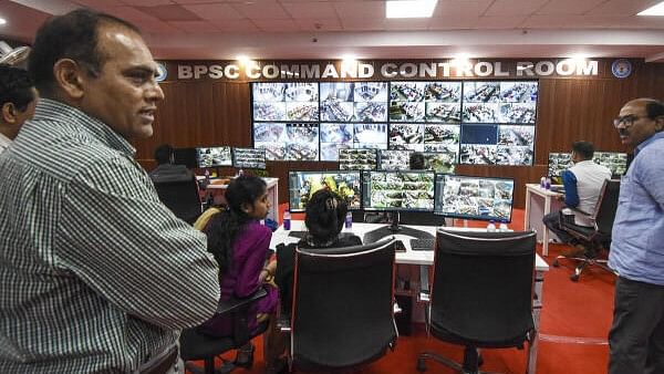 <div class="paragraphs"><p>Bihar Public Service Commission (BPSC) chairman Parmar Ravi Manubhai watches the live feed from CCTV cameras installed at various examination centres for the BPSC Head Master exam, at BPSC Command Control Room, in Patna, Friday, June 28, 2024.</p></div>