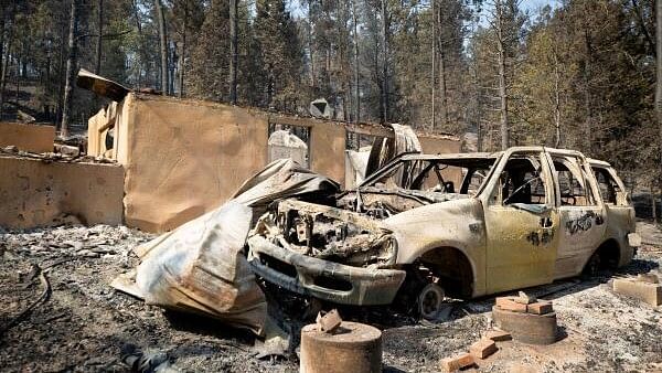 <div class="paragraphs"><p>A burned car stands in front of a ruined building as the South Fork Fire burned most of the structures in Cedar Creek after mass evacuations of the village of Ruidoso, New Mexico.</p></div>