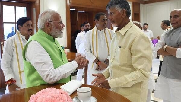 <div class="paragraphs"><p>Prime Minister Narendra Modi seen here at his residence with NDA leaders.</p></div>