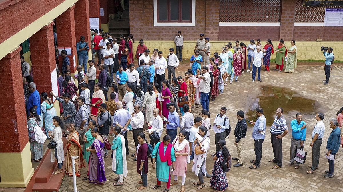 <div class="paragraphs"><p>Voters wait to cast their vote for the biennial Member of Legislative Council (MLC) elections.</p></div>