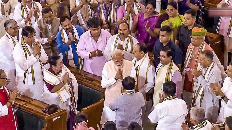 <div class="paragraphs"><p>Senior BJP leader Narendra Modi being greeted by newly elected MPs and other leaders as he arrives to attend the NDA parliamentary party meeting at Samvidhan Sadan.</p></div>