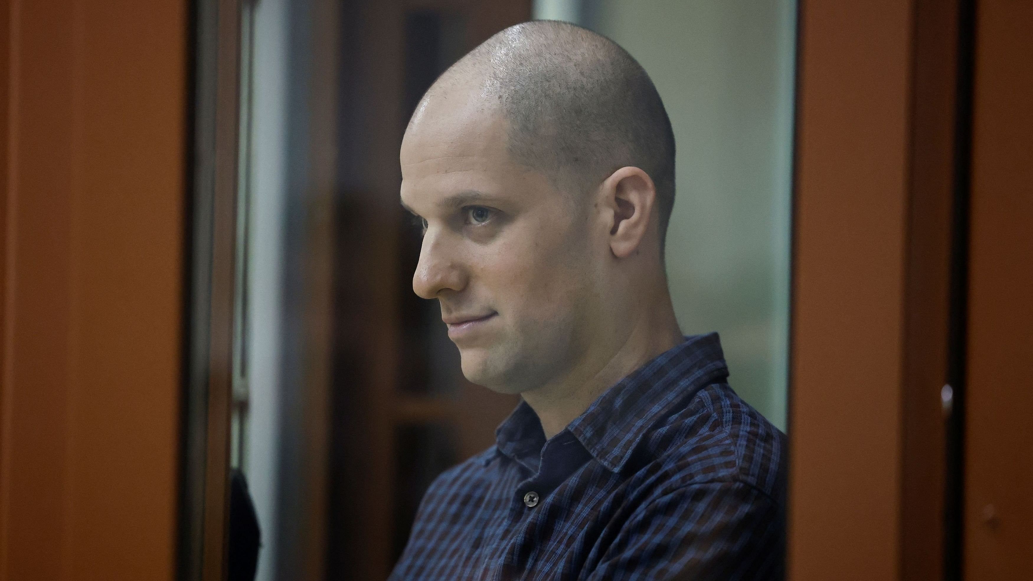 <div class="paragraphs"><p>Wall Street Journal reporter Evan Gershkovich, who stands trial on spying charges, is seen inside an enclosure for defendants before a court hearing in Yekaterinburg.</p></div>