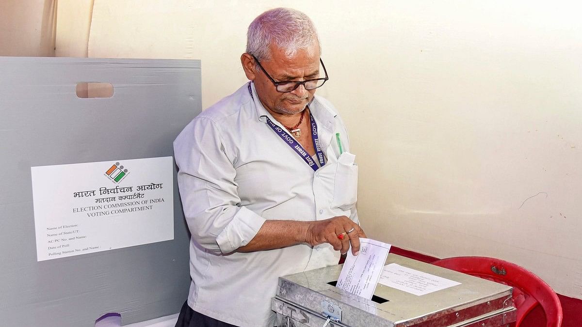 <div class="paragraphs"><p>Patna: A polling official casts his vote via postal ballot for Lok Sabha elections, in Patna, Wednesday, May 22, 2024. </p></div>