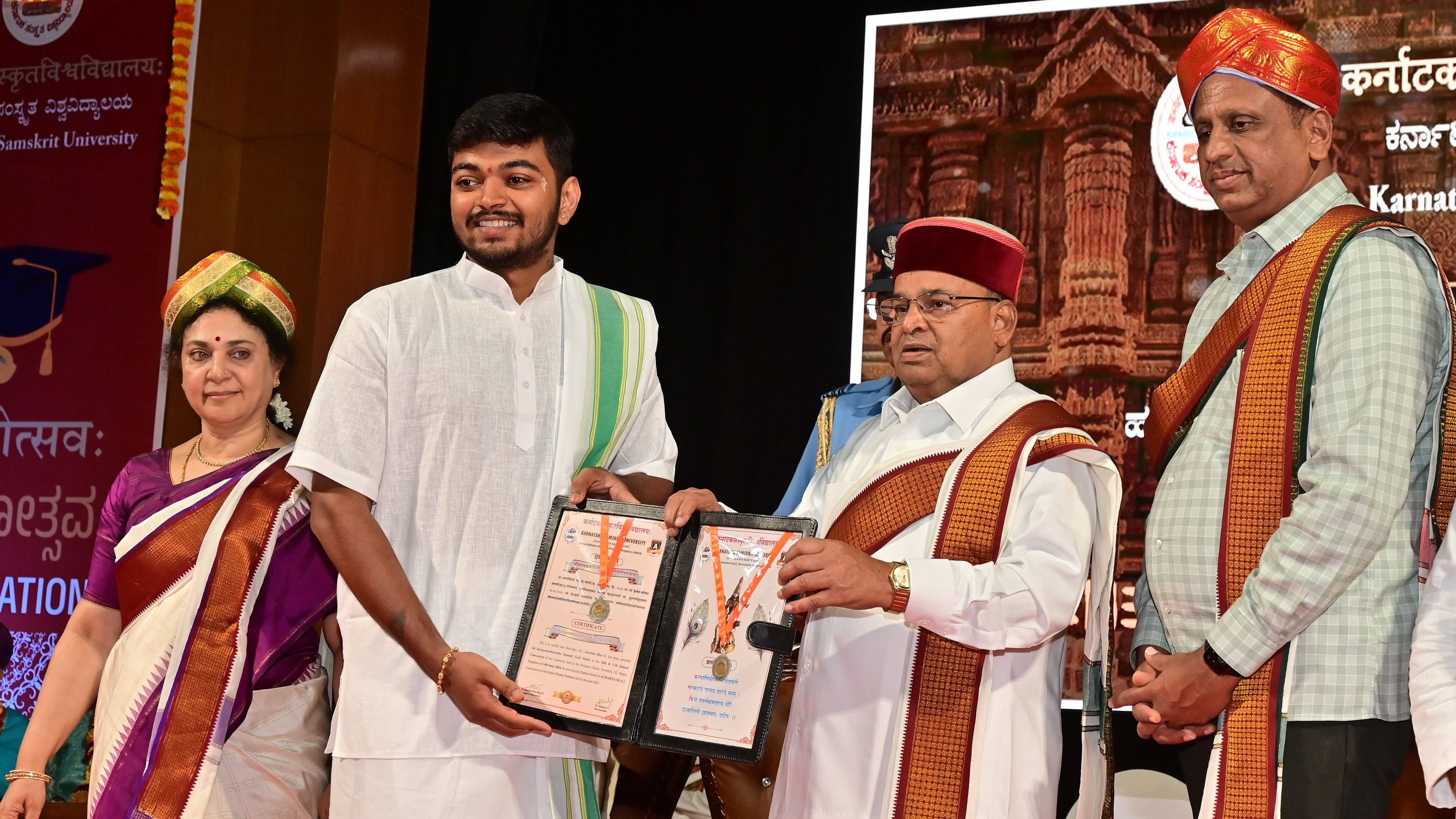 <div class="paragraphs"><p>Karnataka Sanskrit University student C Aravind Bhat receives a gold medal from Governor and Chancellor Thaawar Chand Gehlot during the convocation of the varsity in Bengaluru on Friday. Higher Education Minister Dr M C Sudhakar is also seen. </p></div>