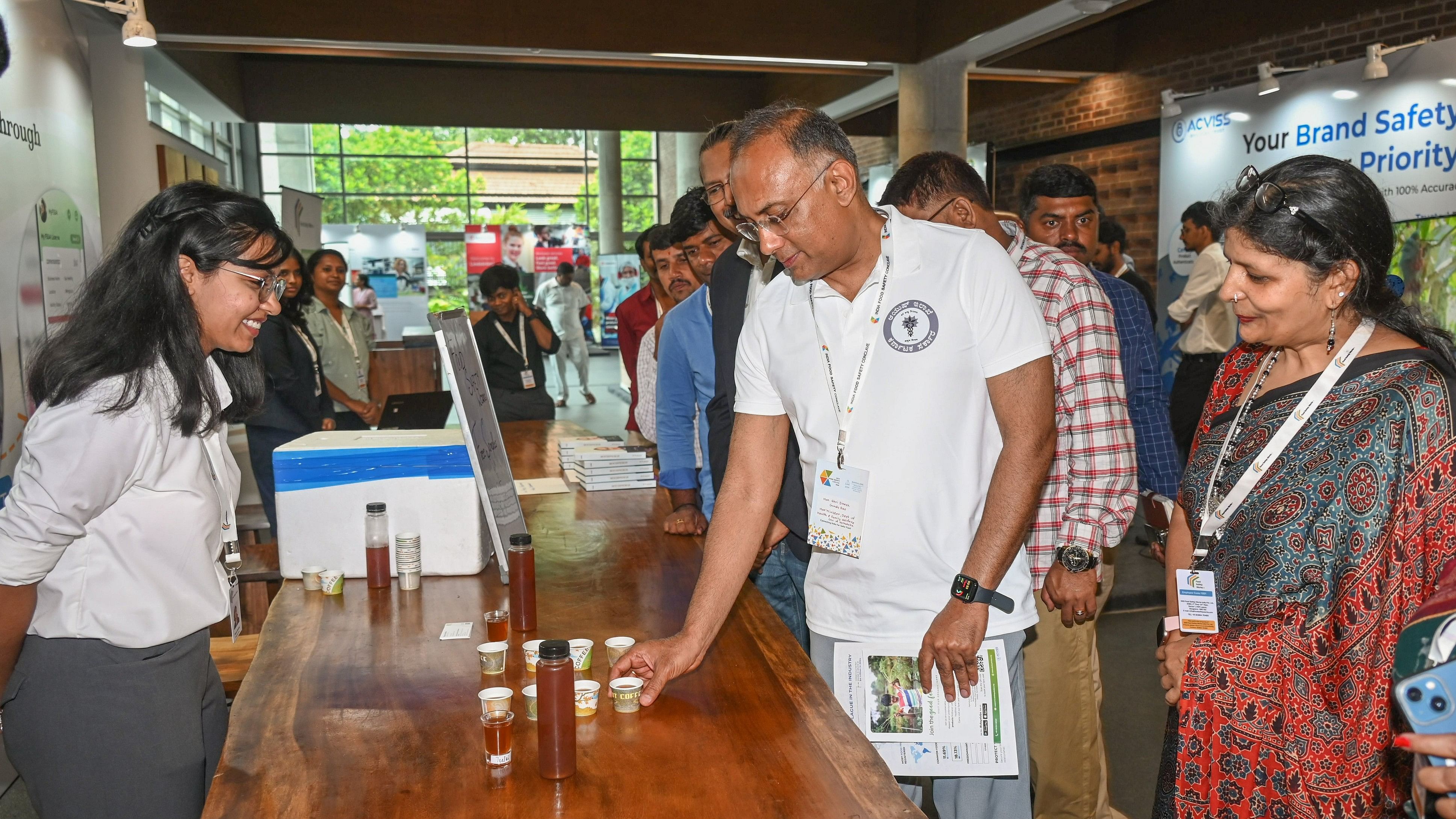 <div class="paragraphs"><p>Karnataka Health Minister Dinesh Gundu Rao&nbsp;looks at products exhibited at India Food Safety Conclave 2024 in Bengaluru on Friday. </p></div>