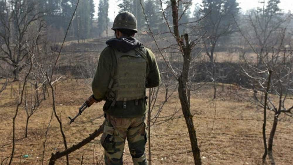 <div class="paragraphs"><p>File photo showing apolice official standing guard in Bandipora.</p></div>