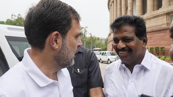 <div class="paragraphs"><p>Congress MP Rahul Gandhi with party MP Kodikunnil Suresh at the Parliament House complex during the first session of the 18th Lok Sabha, in New Delhi, Tuesday.</p></div>