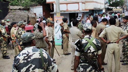 <div class="paragraphs"><p>Security personnel stand in front of a polling booth after an incident of violence during polls in West Bengal.&nbsp;</p></div>