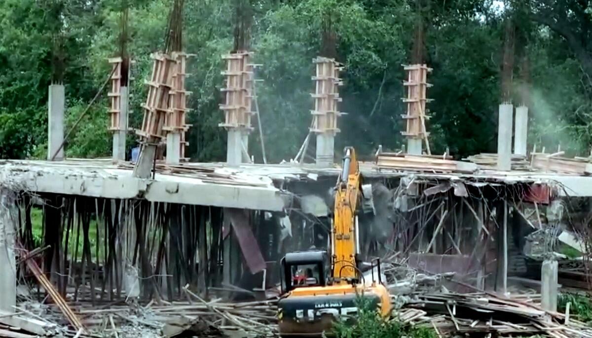 <div class="paragraphs"><p>An under construction central office of YSRCP being demolished, at Tadepalli in Guntur district, Saturday, June 22, 2024. </p></div>