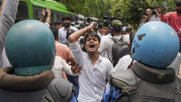 <div class="paragraphs"><p>NSUI activists raise slogans during their ‘Chhattra Sansad Gherav’ protest at Jantar Mantar against the alleged irregularities in NEET-UG and cancellation of UGC-NET exams, in New Delhi, Monday, June 24, 2024. </p></div>