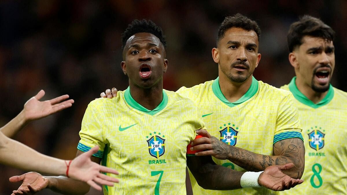 <div class="paragraphs"><p>Brazil's Danilo and Vinicius Junior react after Spain were awarded a penalty.</p></div>